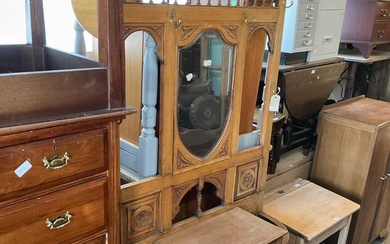 An early 20th century carved oak hall stand with shield...
