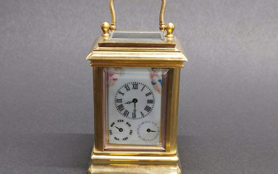 BRASS AND PORCELAIN CARRIAGE CLOCK.