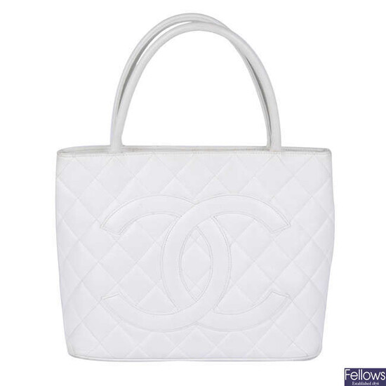 CHANEL - a white quilted Caviar Medallion Tote.