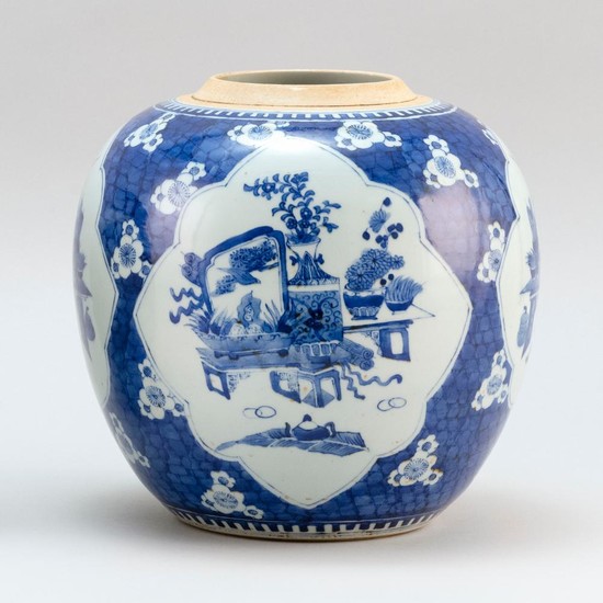 CHINESE BLUE AND WHITE PORCELAIN GINGER JAR In ovoid form, with decoration of scholars' items on a prunus and cracked-ice ground. He..
