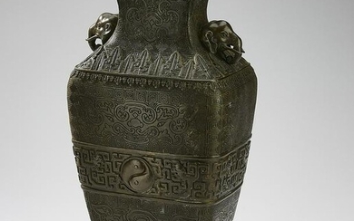 Chinese bronze vase with bats, taotie and fretwork