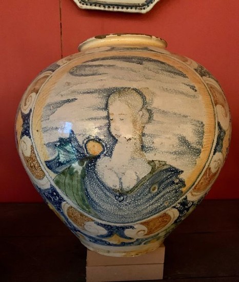 Earthenware ball-shaped vase with polychrome decoration of busts...
