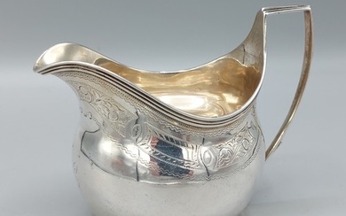 George III silver cream jug with engraved decoration, London...