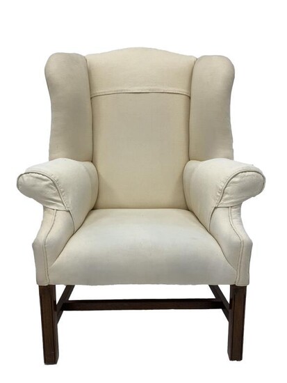 George III style mahogany framed wingback armchair, upholstered in...