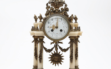 Louis XVI style table clock in marble and bronze, early 20th Century.