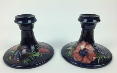 Pair of Moorcroft pottery candlesticks decorated in the Anemone pattern, impressed marks and original paper labels to both bases - Potters To The Late Queen Mary, 11cm high