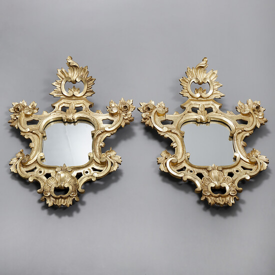 Pair of Rococo style ornamental mirrors in carved and gilt wood, 19th Century.