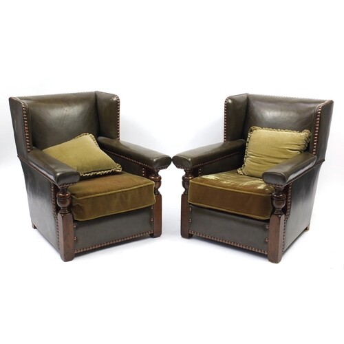 Pair of oak framed green leather wingback armchairs, 84cm hi...