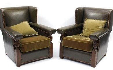 Pair of oak framed green leather wingback armchairs