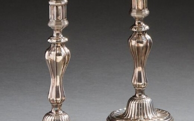 Pair of silver candlesticks with canals and gadroons...