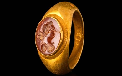 ROMAN GOLD FINGER RING WITH CARNELIAN INTAGLIO DEPICTING A YOUNG WOMAN