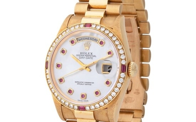 Rolex. Charismatic and Colorful Day-Date Automatic Wristwatch in Yellow Gold, Reference 18 378, With Ruby Mother of Pearl and Bezel, Sticker Rolex and Warranty