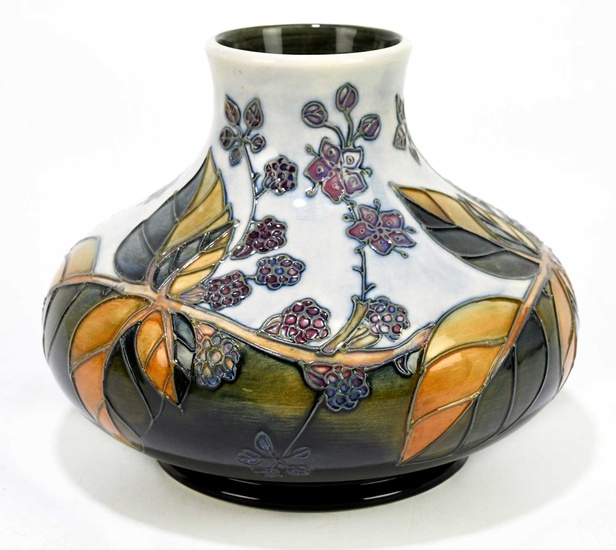 SALLY TUFFIN FOR MOORCROFT; a squat vase decorated in the...