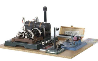 Steam engine, driving model Märklin and Wilseco, steam engine 16051, replica of an engine from the 1930s, horizontal cylinder, 2 flywheels with double cord pulley, complete with steam dome, steam whistle, steam stopcock, three-way valve, etc. LxWxH:...