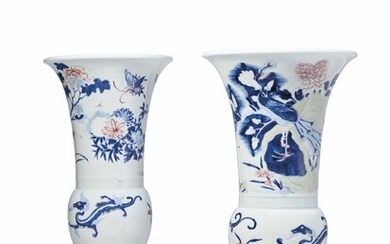 TWO COPPER-RED AND CELADON-DECORATED CARVED BLUE AND WHITE BEAKER VASES, KANGXI SIX-CHARACTER MARKS IN UNDERGLAZE BLUE WITHIN DOUBLE CIRCLES AND OF THE PERIOD (1662-1722)