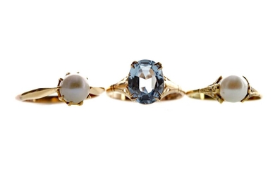 TWO PEARL RINGS AND A BLUE GEM SET RING