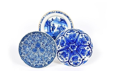 Three Delft chargers 18th century, one fluted and...