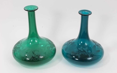 Two similar 19th century green tinted glass decanters, with etched foliate patterns, 19.5cm and 21cm high (no stoppers)
