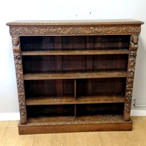 Victorian carved oak Gothic style open bookcase with foliate...