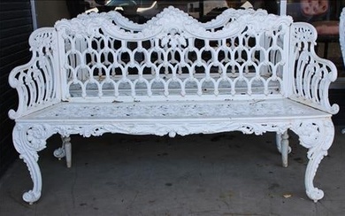 White cast iron garden bench with pierced back and seats