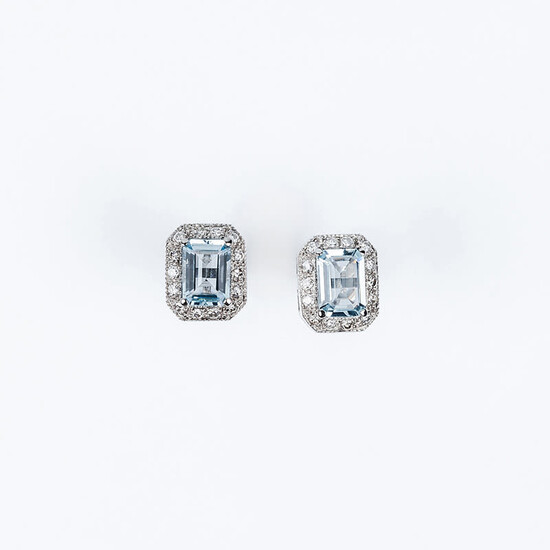 White gold earrings with a rectangular topaz center, claws,...