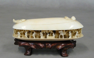 A semi-open ivory mold discovering an animated scene of many...