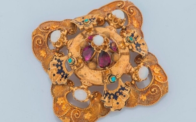 18K yellow gold pendant brooch composed of eight articulated petals stylizing a flower unfurled and closed with a paste cross, a round one set in its center with four drop-cut amethysts enhanced with a cabochon opal, framed by four arabesque cut...