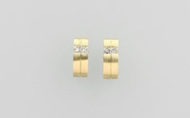 Pair 14 kt gold earrings with diamonds...