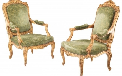 A Large Pair of Louis XV Carved Giltwood Fauteui