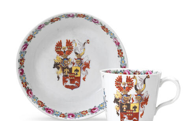 A Nymphenburg Hausmaler armorial cup and saucer