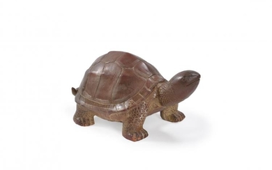 A glazed pottery tortoise sculpture