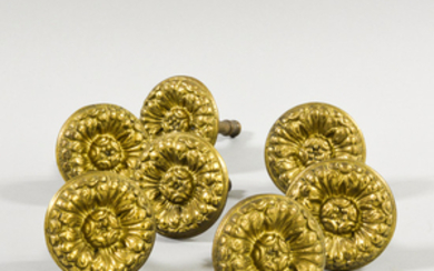 Set of Seven Molded Brass Floriform Tiebacks