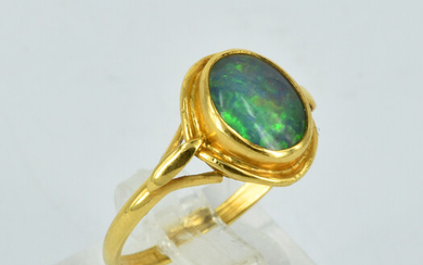 A 9CT GOLD AND OPAL RING