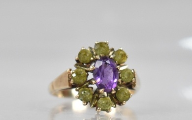 A 9ct Gold, Amethyst and Peridot Ring, Central Oval Cut Amet...