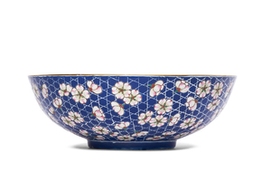 A BLUE-GROUND FAMILLE ROSE ‘PRUNUS’ BOWL, DAOGUANG PERIOD (1821-1850), XIEZHU ZHUREN ZAO HALL MARK IN IRON RED WITHIN A SQUARE
