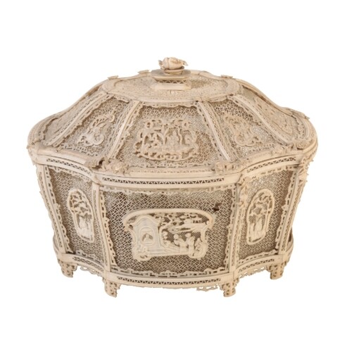 A CHINESE IVORY BASKET of shaped form finely carved and pier...