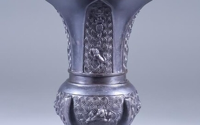 A Chinese Bronze Flared Vase of Archaic Form, moulded...