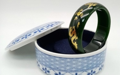 A Chinese Green Jade bracelet with a gold dragon...