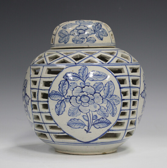 A Chinese Provincial blue and white pottery ginger jar and cover, 20th century, the globular body pa