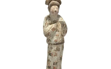 A Chinese painted pottery figure of a court lady Tang dynasty Modelled...