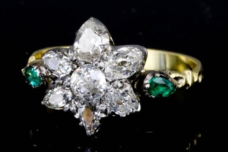 A Diamond and Emerald Flowerhead Pattern Ring, 20th Century,...
