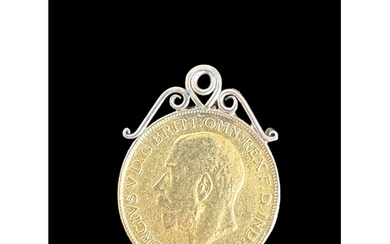 A George V full gold sovereign, 1911 Hard soldered as a pend...