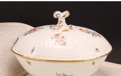A German porcelain oval tureen and cover, moulded with flute...