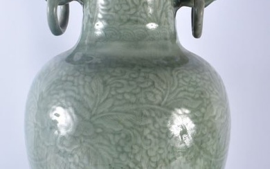 A LARGE 18TH/19TH CENTURY CHINESE TWIN HANDLED CELADON VASE decorated with foliage and vines. 54 cm