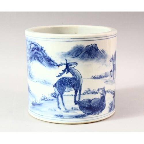 A LARGE CHINESE BLUE AND WHITE BRUSH POT, decorated with dee...