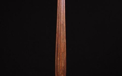 A Late 19th Century Mahogany Tripod Torchère. The round dished top on a reeded baluster column above