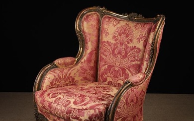 A Louis XV Style Upholstered Bergère Armchair. The padded tub back, winged sides, seat and swab cush
