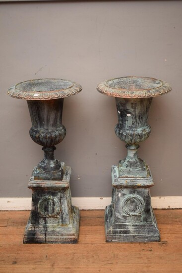 A PAIR OF CAST IRON URNS (106H X 47DIMAMETER CM) (PLEASE NOTE THIS HEAVY ITEM MUST BE REMOVED BY CARRIERS AT THE CUSTOMER'S EXPENSE...