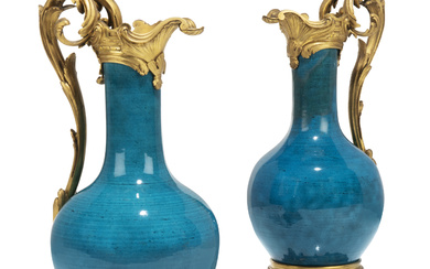 A PAIR OF FRENCH ORMOLU-MOUNTED BLUE-GLAZED CHINESE PORCELAIN EWERS THE...