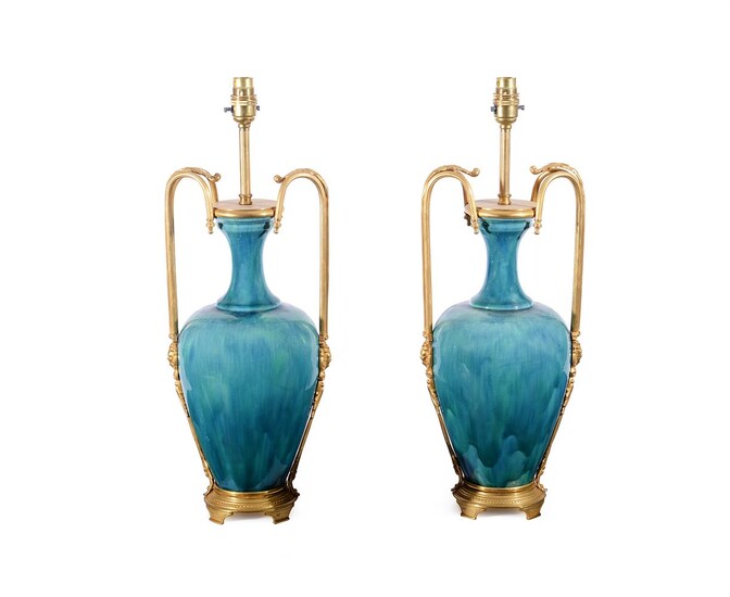 A PAIR OF GILT METAL MOUNTED TURQUOISE GLAZE POTTERY VASE LAMP BASES IN THE SEVRES STYLE